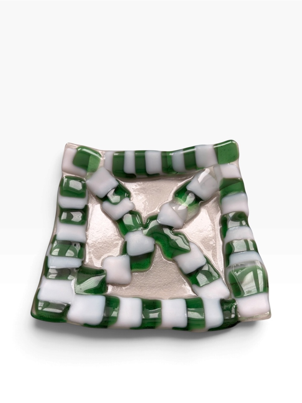Handcrafted art glass trinket dish in green and white checkered design